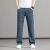 Jeans de sarja fina de verão de alta qualidade para homens, corte reto solto, tamanho grande, perna larga, elástico, calças de alta qualidade de Guangzhou Xintang