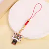 Colgante para teléfono móvil de danza del león de bendición, accesorio para bolso y llavero de coche, colgante auspicioso de hilo rojo estilo chino, disponible para venta al por mayor