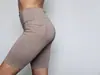 Precio directo de fábrica, shorts deportivos para mujer de imitación de nailon de alta elasticidad con bolsillos, talla estándar de EE. UU.