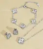 Conjunto de Joias de Aço Inoxidável Banhado a Ouro 18K, Trevo de Quatro Folhas, Colar, Pulseira e Brincos, Venda Quente Transfronteiriça, Atacado Direto da Fábrica