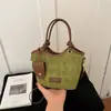 Bolso de mano de mujer de alta gama, nicho, estilo vintage, de importación, nuevo bolso de hombro de moda 2026, bandolera tipo cubo versátil