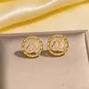 Pendientes de cobre con incrustaciones de diamantes, los más vendidos transfronterizos europeos y americanos, pendientes de botón exquisitos y únicos de celebridad de internet retro para mujer, versátiles y de alta gama