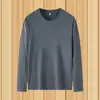 Camiseta de manga larga de color liso para hombre para primavera y otoño, estilo ins Hong Kong, corte holgado, negro puro, cuello redondo, talla grande, top de capa base