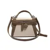 Bolso Pequeño Cuadrado de Diseño de Nicho Transfronterizo para Mujer Nuevo Bolso de Mano de Lona Empalmada Retro de Alta Gama Cruzado Multiusos de Moda