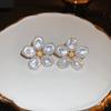 Pendientes de plata con forma de mariposa y flor de perla retro francesa, pequeños y exquisitos, de alta gama, con diseño de hada súper dulce para mujer.