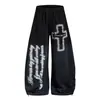 Calça de moletom estilo americano, de rua, com aspecto desgastado, estampa de letras cruzadas, perna larga, corte curvo, unissex, adequada para dança de jazz, com um estilo fluido e casual