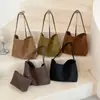Bolso de cubo tejido retro transfronterizo, bolso de mano de estilo coreano moderno y de moda, simple y versátil para el trabajo y el uso casual, bolso de hombro al por mayor