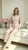 Nuevo traje suelto casual 2026 para mujer, estilo dulce, estampado floral pequeño, conjunto de dos piezas de manga larga, ropa de estar para mujer 7092