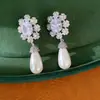 Aretes de aguja de plata con circonita, broqueles de flor ovalada y perla gota de agua, aretes exquisitos estilo palacio, sensación de lujo ligero y alta gama