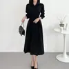 Chic coreano colección de otoño nueva: Vestido largo de botones, diseño de nicho estilo francés, asimétrico, entallado a la cintura, adelgazante, de manga larga