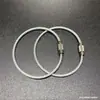 Em estoque Chaveiro de anel de cabo de aço Anel de aço inoxidável com revestimento de borracha colorida Fivela de trava de cabo de aço com revestimento de plástico Grande quantidade negociável E18