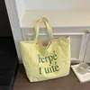 Nuevo bolso tote casual estilo coreano de Shuai Mi, bolso de mano de moda con estampado de letras, bolso de hombro a rayas de doble cara para mujer