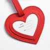 Etiqueta de equipaje con forma de corazón dulce transfronteriza con etiqueta con logotipo de firma, cuero PU, etiqueta de embarque colgante de moda anti-pérdida, personalizable