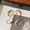 Aretes de metal huecos con forma de gota de agua chapados en oro latón, simples, estilo frío ins, elegantes europeos y americanos, combinan con todo para mujer