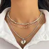 Collar Clavícula Retro Francés de Imitación Perla con Borla de Corazón de Tres Capas Apilable Europeo y Americano Nicho Temperamento de Gama Alta para Mujeres