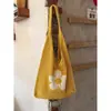 Bolsa de Palha Trançada Floral Vazada Casual e Minimalista 2026 Novo Estilo de Férias Bolsa de Ombro Tote de Grande Capacidade