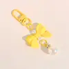 Colgante de macarrón con lazo de moda accesorio para teléfono con corbata de lazo para llaves accesorio para funda de auriculares accesorio para bolsa y ropa regalo para estudiante