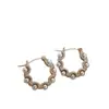 Pendientes geométricos de perlas y circonitas transfronterizos europeos y americanos, pendientes exquisitos de nicho de lujo ligero de alta gama, accesorios para orejas simples y elegantes para mujer