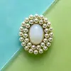 Accesorios populares para el cabello de novia, zapatos, ropa, bolsos y joyería de aleación con doble anillo y perla ovalada con incrustaciones de piedras preciosas disponibles para venta al por mayor