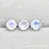 Aleación de titanio ASTM F-136 garra redonda con ópalo G23 titanio nuevo aretes de ópalo joyería para piercing corporal