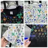Moda Nueva de Verano Lujo Ligero Estampado Completo Letra Manga Corta Hombre Tendencia Suéter Casual Elegante Versátil Cuello Redondo Media Manga