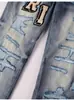 Pantalones vaqueros skinny ajustados y rasgados de color claro para hombre con parche de letra AMR, marca de moda de alta gama transfronteriza, elásticos