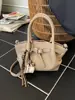 Bolso Cubo de Mano de Alta Gama Estilo Coreano para Mujer 2025 Invierno Nueva Moda Versátil para el Trabajo Hombro Cruzado