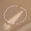 Collar de Perla de Agua Dulce Irregular Cruzada y Estrella de Ocho Puntas de Nácar para Mujer, Diseño de Nicho de Lujo Ligero con Diseño Asimétrico