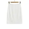 Venta al por mayor de ropa para mujer estilo europeo y americano transfronteriza, falda bodycon de cintura media-baja a la moda y versátil, falda midi adelgazante