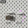 El tablero perforado de metal engrosado de IKEA se puede fijar magnéticamente a la pared, sirviendo como un estante de almacenamiento sin borde y se puede fijar magnéticamente