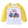Camiseta infantil de primavera y otoño 2023, nueva camiseta de manga larga con cuello redondo y dibujos animados, camiseta de algodón para bebés y niños.