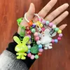 Nuevo Llavero Colgante de Conejo Acrílico Tridimensional Galvanizado Accesorios Pequeños Frescos de Colores con Cuentas Decoración para Cubierta de Auriculares