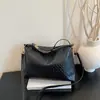 Patrón tejido texturizado, nueva colección 2026, moderno y elegante, diseño único, versátil, bolso de hombro simple, bolso cruzado y bolso de mano