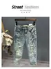 Jeans de Nueve Puntos Retro con Parche Roto para Hombre Marca de Moda Corte Slim Fit Cónico Estilo Primavera/Otoño Canalla Genial Estampado Casual Pantalones 9