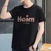 Moda Coreana Simple y Elegante Nueva Camiseta de Manga Corta para Hombre Verano Top de Media Manga Estilo Hong Kong Holgado Casual Tendencia Marca Camiseta