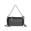 Bolso de hombro de moda para mujer 2022 nuevo diseño tachuelas bandolera lujo ligero estilo extranjero cilíndrico bolso de axila al por mayor