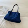 Bolso tote minimalista de estilo coreano con un aire relajado, color liso, nueva colección otoño 2026, gran capacidad, adecuado para el trabajo y los desplazamientos, bolso de hombro o bolso de axila
