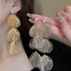 Aretes de borla de flor hueca de circón súper hada temperamento aguja de plata aretes comodín aretes de ambiente exagerado europeo y americano al por mayor