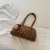 Bolsa de bowling de nicho estilo coreano, nova coleção outono 2026, bolsa de ombro de grande capacidade, bolsa almofada moderna e estilosa para trabalho e deslocamento