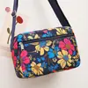Bolsa de pano de flores Nova bolsa crossbody feminina Pano Oxford Bolsa de mãe de meia-idade e idosa Bolsa Bolsa de ombro multicamadas Bolsa de lona