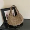 Bolso tote minimalista de estilo coreano con textura de lunares para el hombro para mujer, nuevo modelo 2026, alto valor estético, bolso de mano y bolso de hombro únicos para mujer