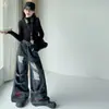 Nueva colección de otoño para niñas: pantalones de mezclilla rotos elegantes y geniales, overoles holgados para niños mayores y pantalones largos que estilizan