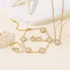 Pulsera, Pendientes, Anillo de Trébol de Cuatro Hojas de Nácar de Doble Cara de 13 mm de Venta Caliente Transfronteriza, Juego de Cuatro Piezas al por Mayor desde el Fabricante