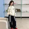 Conjunto Deportivo Casual para Niñas 2026 Otoño Nueva Moda Sudadera con Cuello Alto y Pantalones de Pierna Ancha Conjunto de Dos Piezas para Niños Mayores