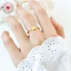 Anillo de amor de viento de metal, diseño de nicho femenino que no se desvanece, anillo hueco chapado en oro, joyería de acero de titanio geométrica de moda