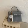 2026 Nueva Moda Trendy Bolso con Hebilla de Cierre Texturizada Estilo Ins Bolso Pequeño Cuadrado para Mujer Primavera y Verano Bolso Cruzado Artístico Elegante