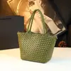 Bolso de Mano Genuino Estilo Resort 2026 Nuevo Casual Versátil Pequeño Bolso Tejido de Hombro Bolso Cruzado Simple para Mujer