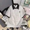 Camisa polo falsa de duas peças com blocos de cor estilo Hong Kong para homens, camiseta fina de manga curta com lapela da moda para o verão, top versátil