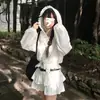 Camisa chic de jacquard de un solo botón con cordones en la cintura y capucha