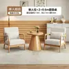 Sillas de sofá de madera maciza estilo nórdico, muebles de ocio para balcón, juegos populares para cafeterías y hoteles, y mesas y sillas de recepción para reuniones y encuentros